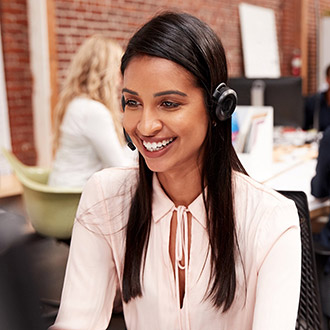 Person wearing a headset while talking on phone call