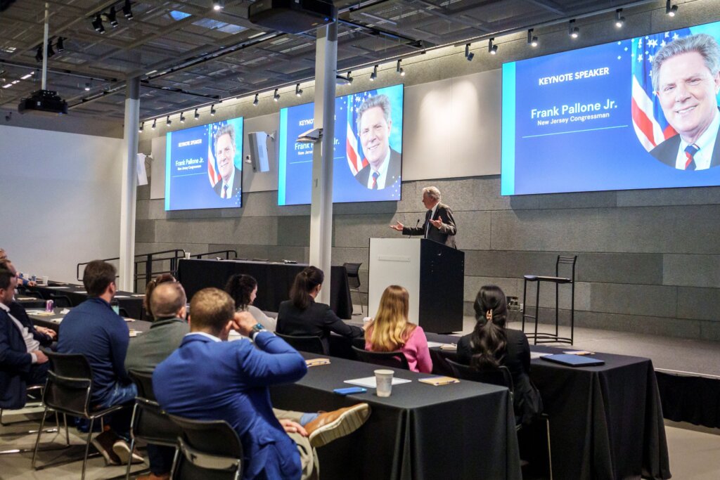 A speaker addresses an audience