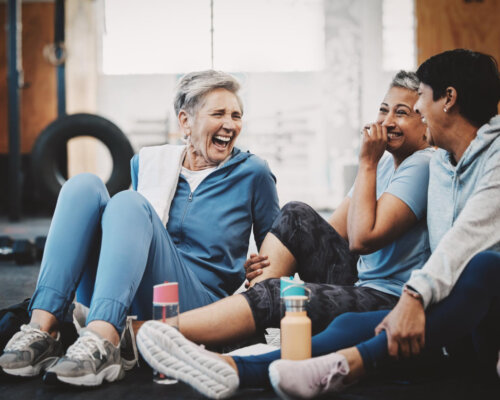Group of people laughing at fitness class
