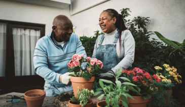 Man and woman working in garden.