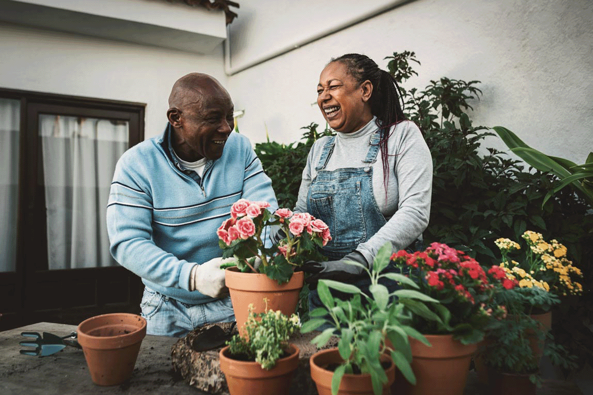 Man and woman working in garden.