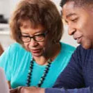 A mother and son reviewing information