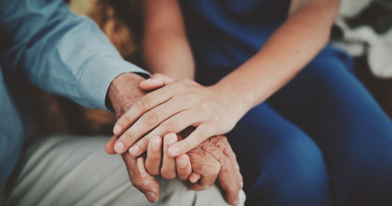 Two people holding hands.