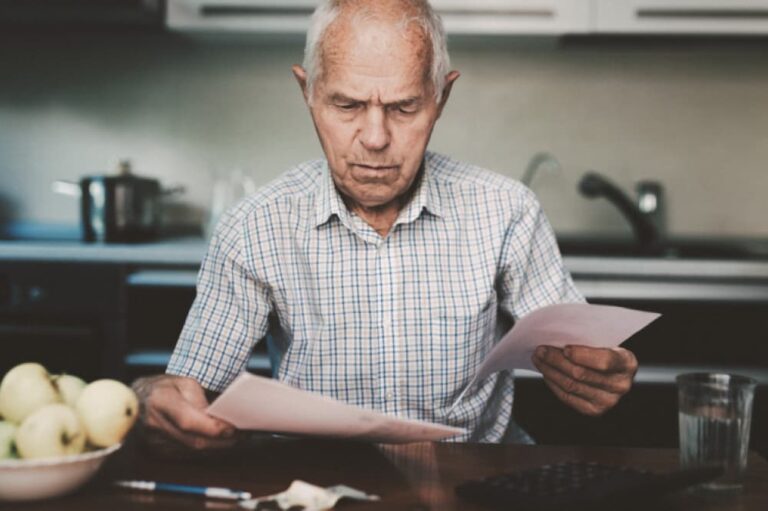 Man examining paperwork.