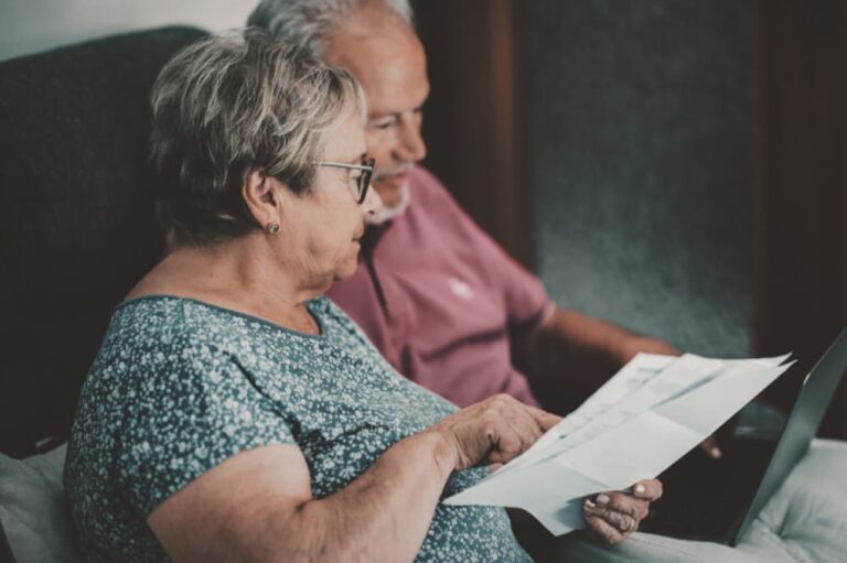 Couple examining paperwork.