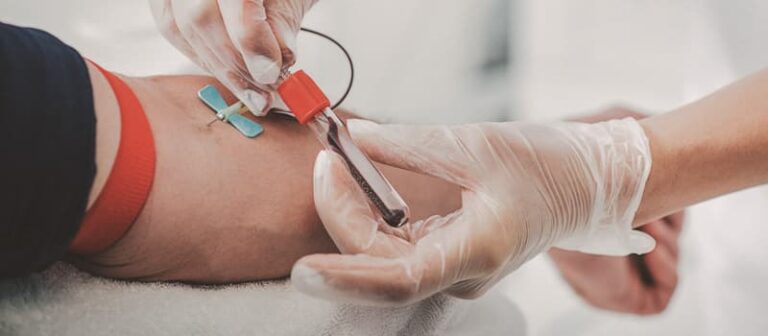 Closeup of blood being drawn.